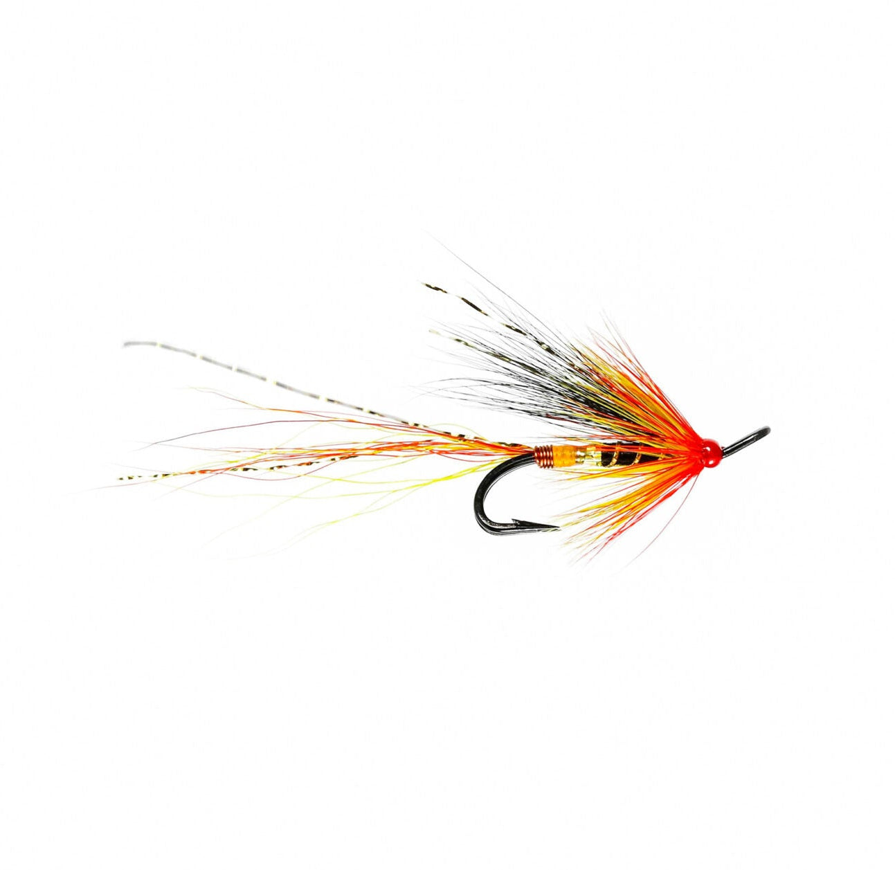 A single fly fishing lure with a black hook, bright red body, orange and yellow feathering, and black-and-white hackle wings, isolated on a solid white background.