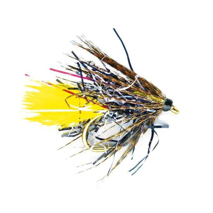 Fishing fly with yellow and brown colors on a white background