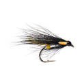A close-up of a fly fishing lure on a solid white background. The lure features a black body, a bright orange belly, yellow and blue-green accents, and black hackle feathers with a silver hook.