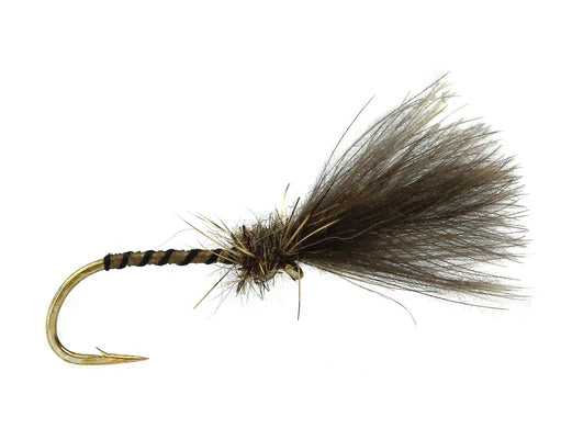 Fishing fly with brown and black feathers on a white background